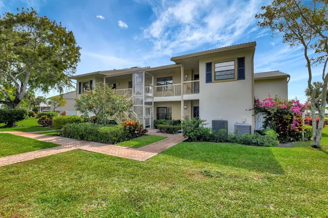 a kitchen with stainless steel appliances granite countertop sink stove top oven and cabinets