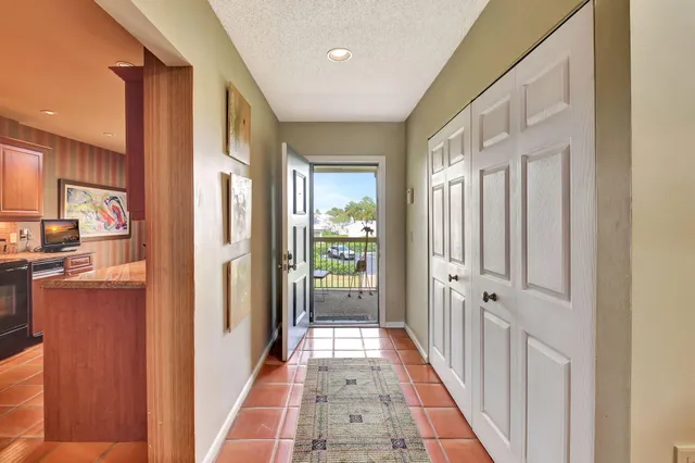 a bedroom with two beds and painting on the wall