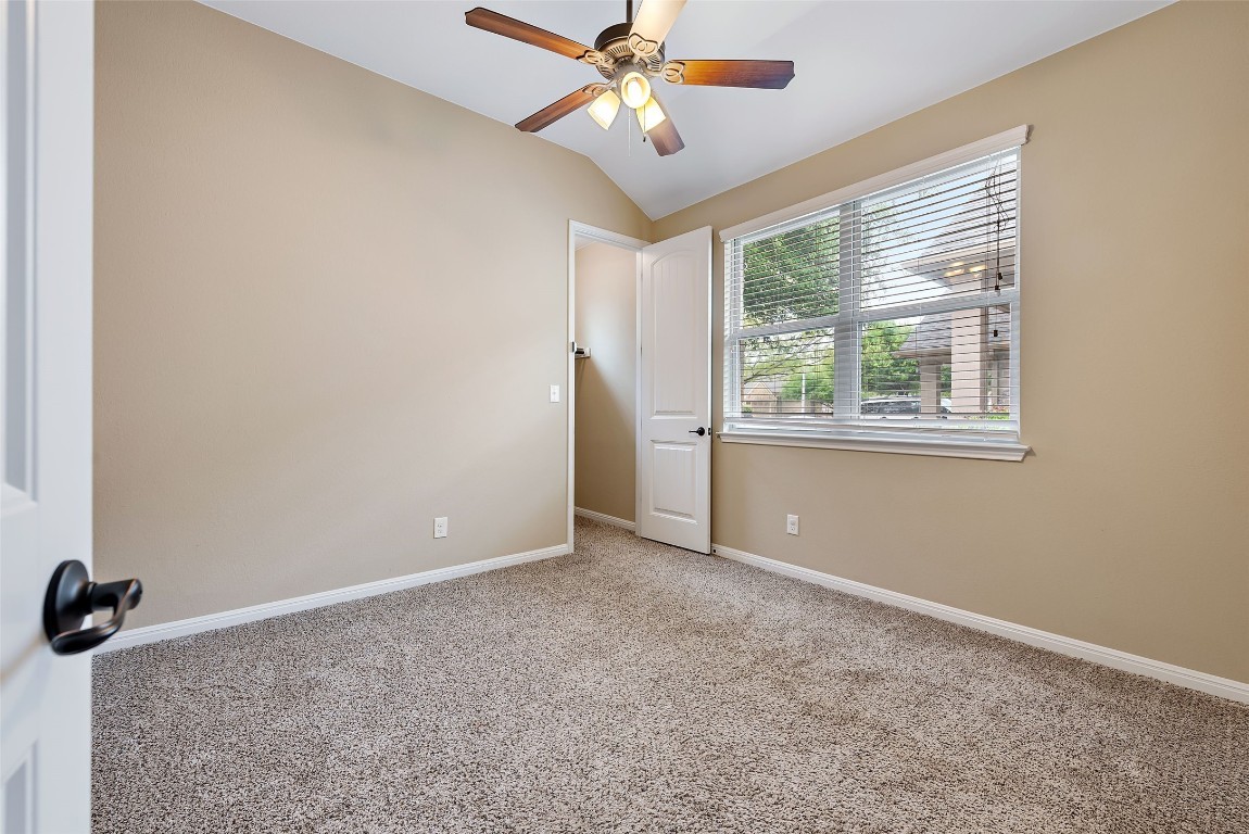 2000 Manada Trail Leander, TX 78641 - Photo 26 of 36 Comfortable carpeting and a ceiling fan create a serene atmosphere for a peaceful retreat.