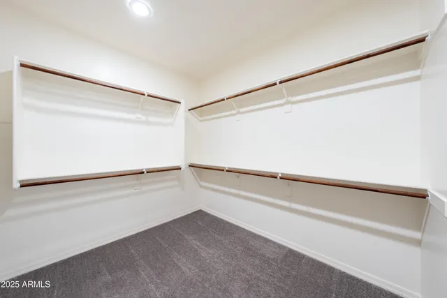 a view of an empty walk in closet