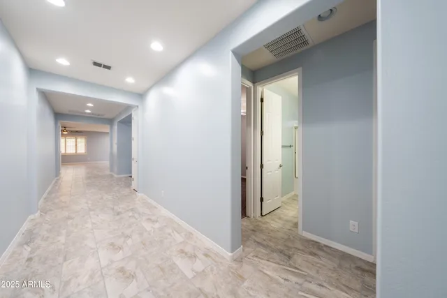 a bathroom with a sink a toilet a mirror and shower