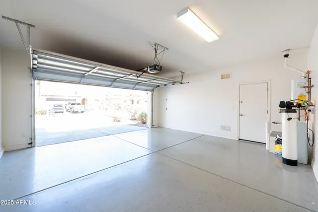 a view of a livingroom with furniture and a ceiling fan