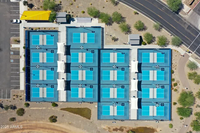 an aerial view of a pool and outdoor space