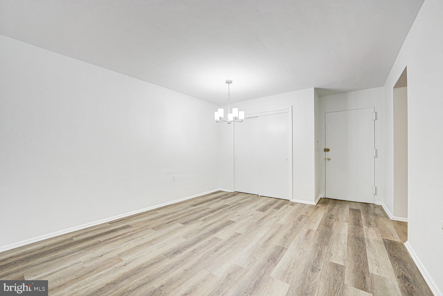 9250 Edwards Way, Unit 207A Hyattsville, MD 20783 - Photo 8 of 17 wooden floor in a room