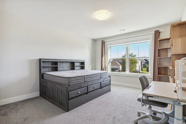 a bedroom with a bed and a cabinets