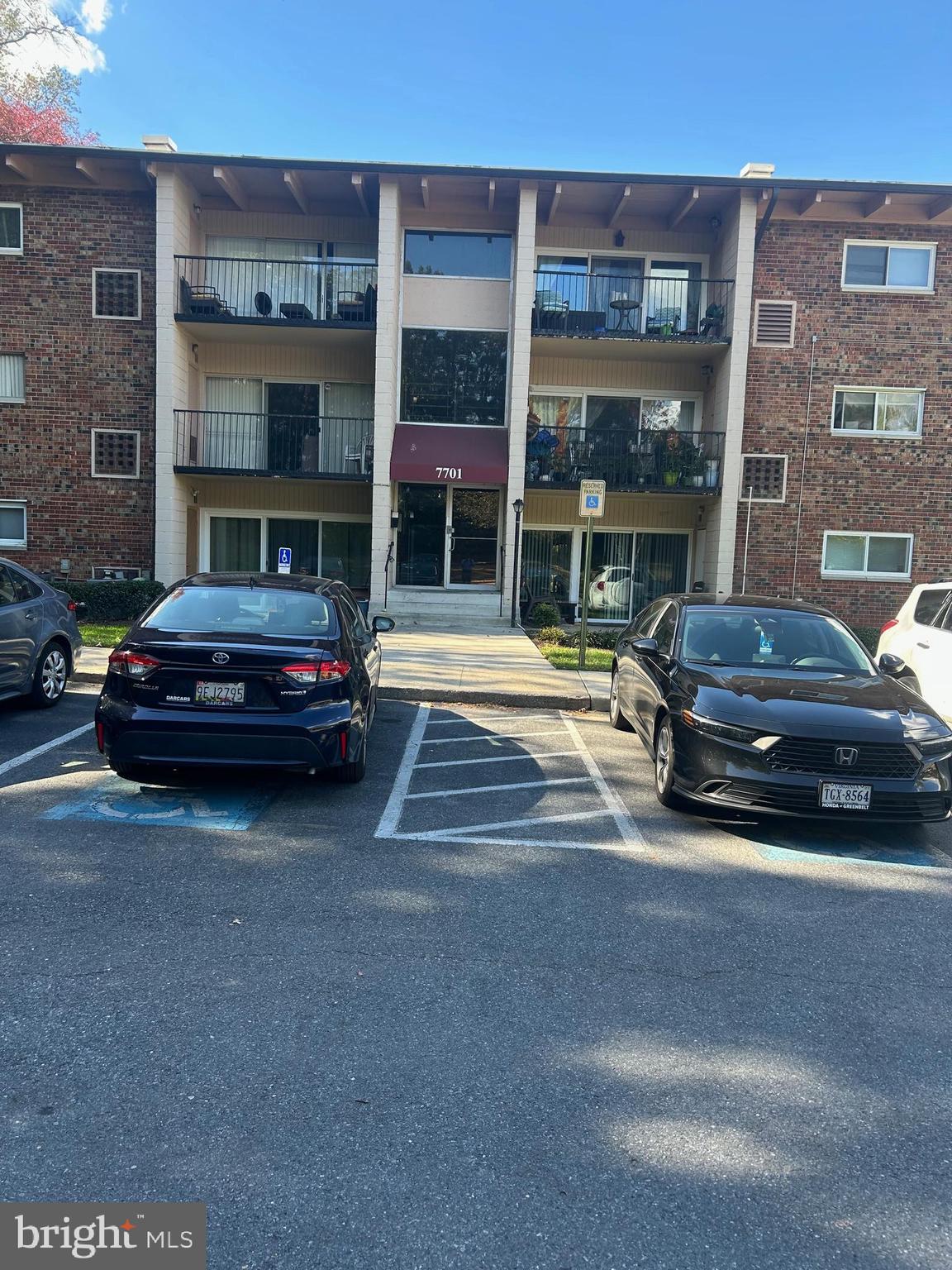 7701 Arehart Drive, Unit 1314 New Carrollton, MD 20784 - Photo 1 of 13 a car parked in front of a building