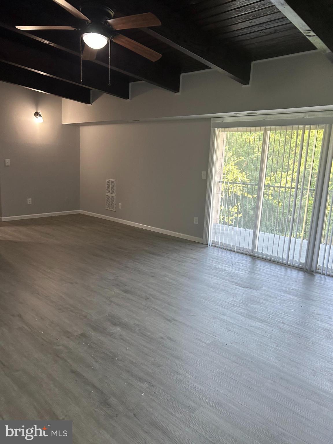 7701 Arehart Drive, Unit 1314 New Carrollton, MD 20784 - Photo 2 of 13 a view of an empty room with wooden floor