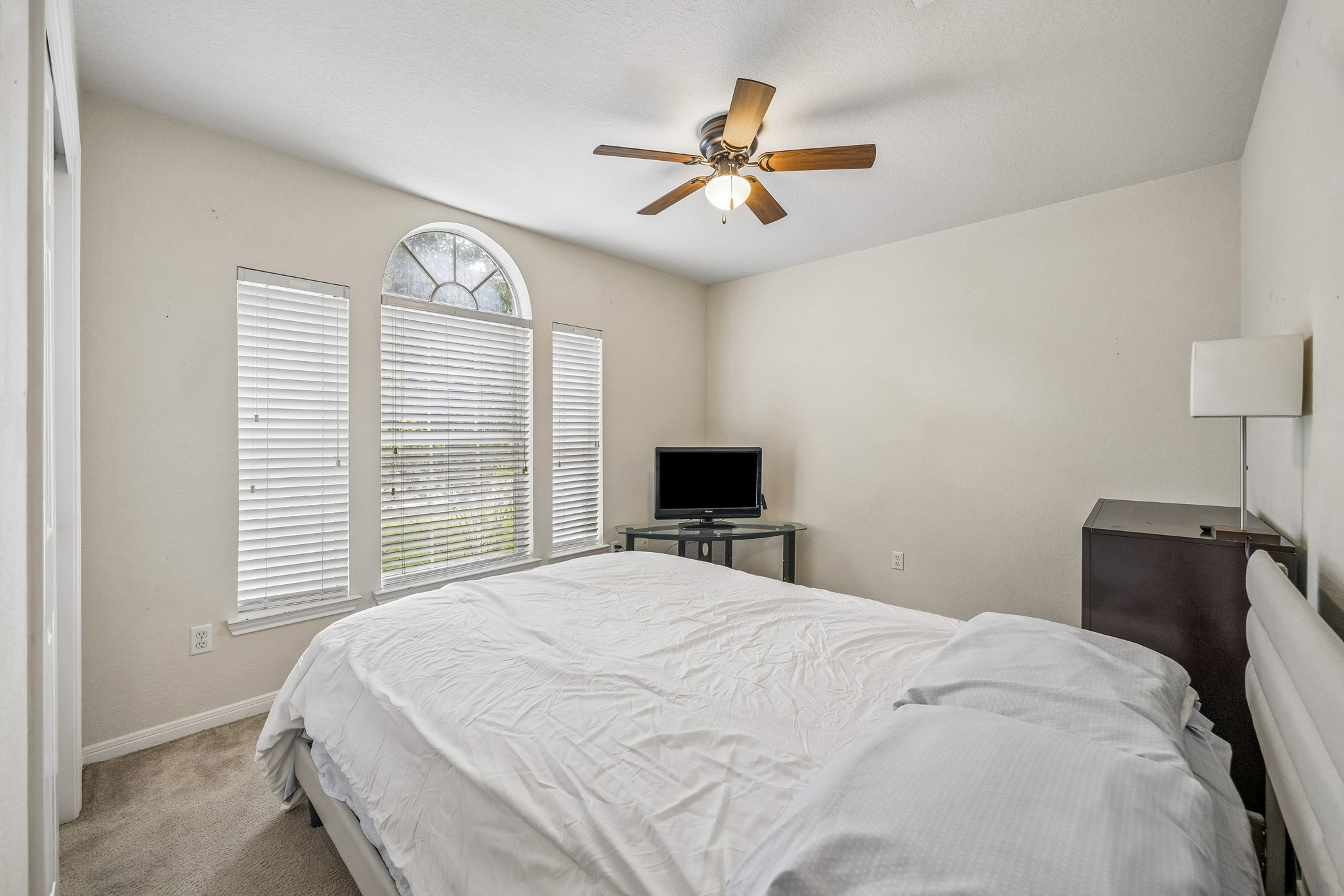 24027 Floragate Drive Spring, TX 77373 - Photo 18 of 21 a bedroom with a bed and window