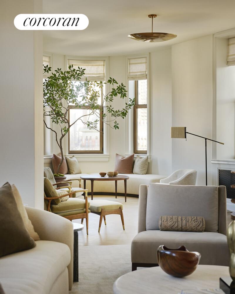 175 5th Avenue, Unit 6NORTH Manhattan, NY 10010 - Photo 3 of 16 a living room with furniture and a large window