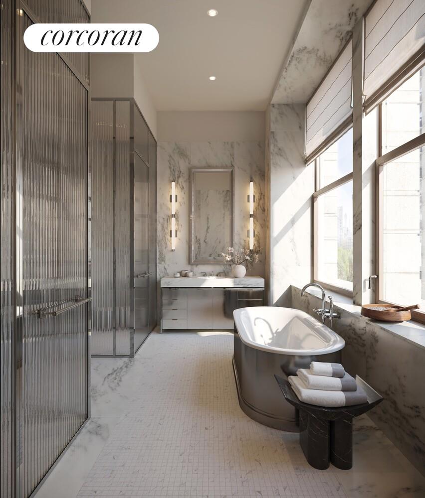 175 5th Avenue, Unit 6NORTH Manhattan, NY 10010 - Photo 8 of 16 a spacious bathroom with a double vanity sink large mirror and a bathtub