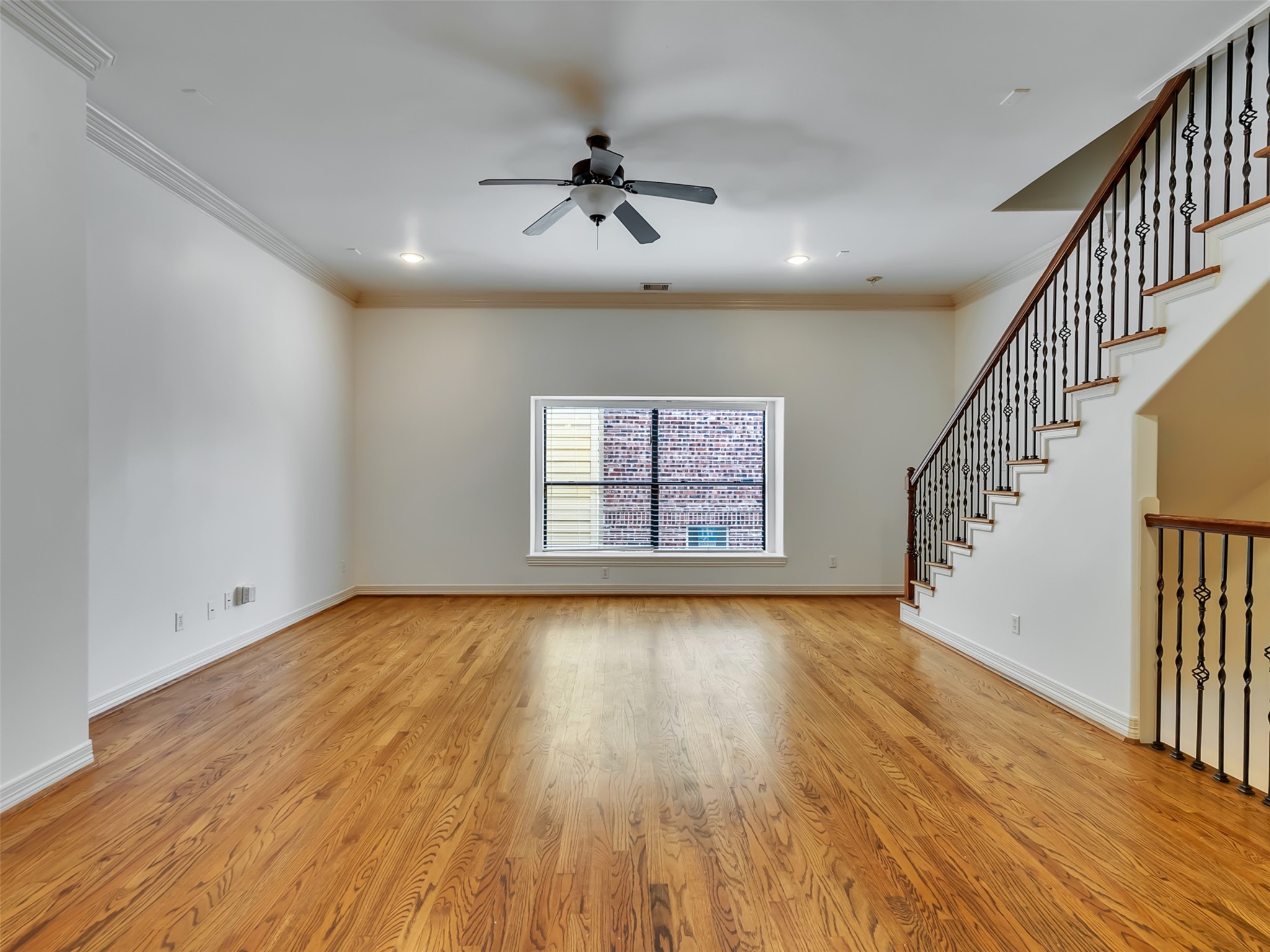 2540 Prospect Street, Unit B Houston, TX 77004 - Photo 19 of 37 wooden floor in an empty room with a window