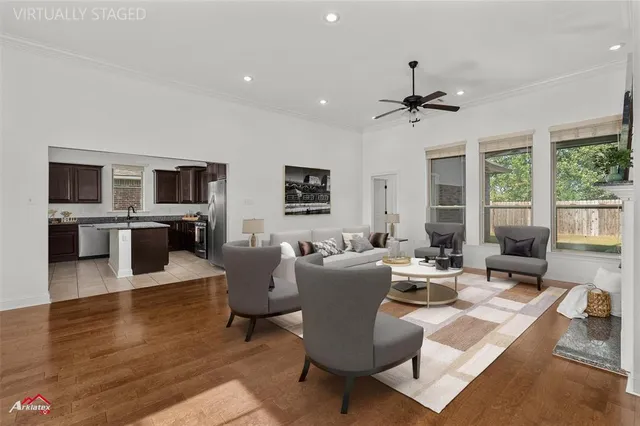 a living room with fireplace furniture and a flat screen tv