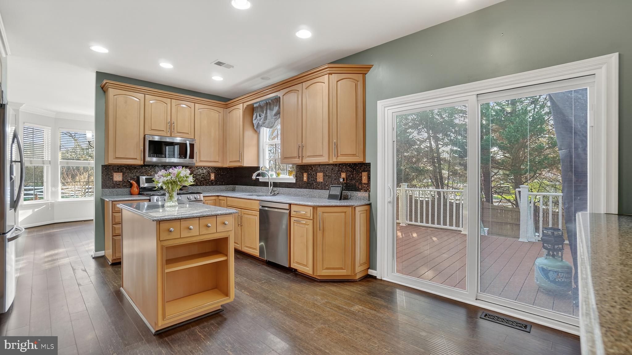 2801 Klein Court Crofton, MD 21114 - Photo 13 of 46 a kitchen with stainless steel appliances granite countertop a stove a sink and a refrigerator