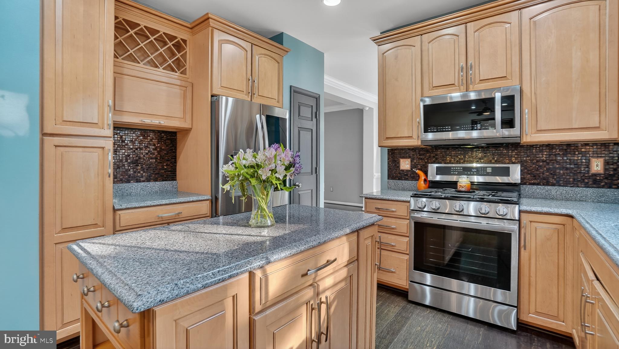 2801 Klein Court Crofton, MD 21114 - Photo 15 of 46 a kitchen with stainless steel appliances granite countertop a stove and a microwave