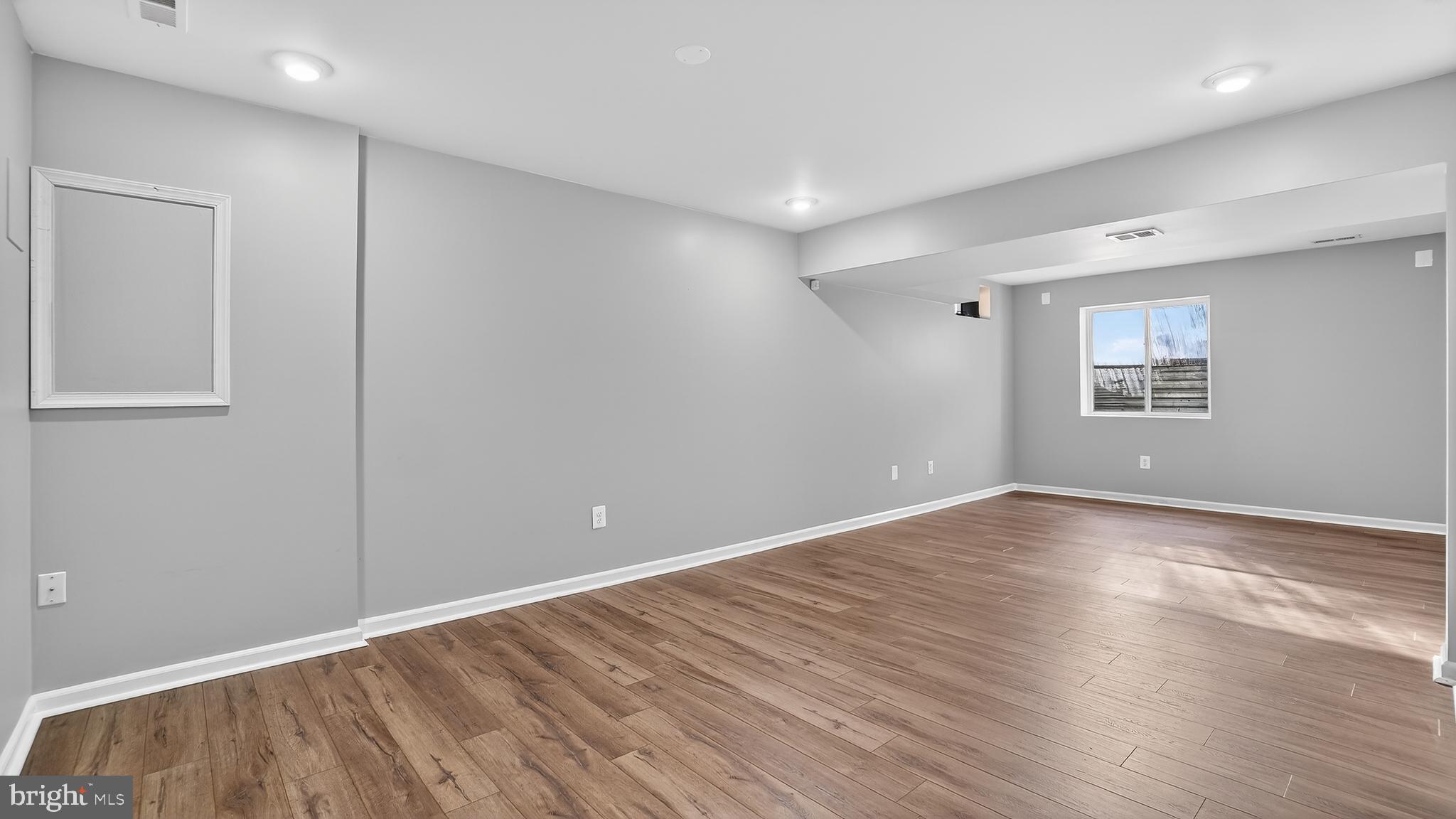 2801 Klein Court Crofton, MD 21114 - Photo 32 of 46 a view of an empty room with wooden floor and a window
