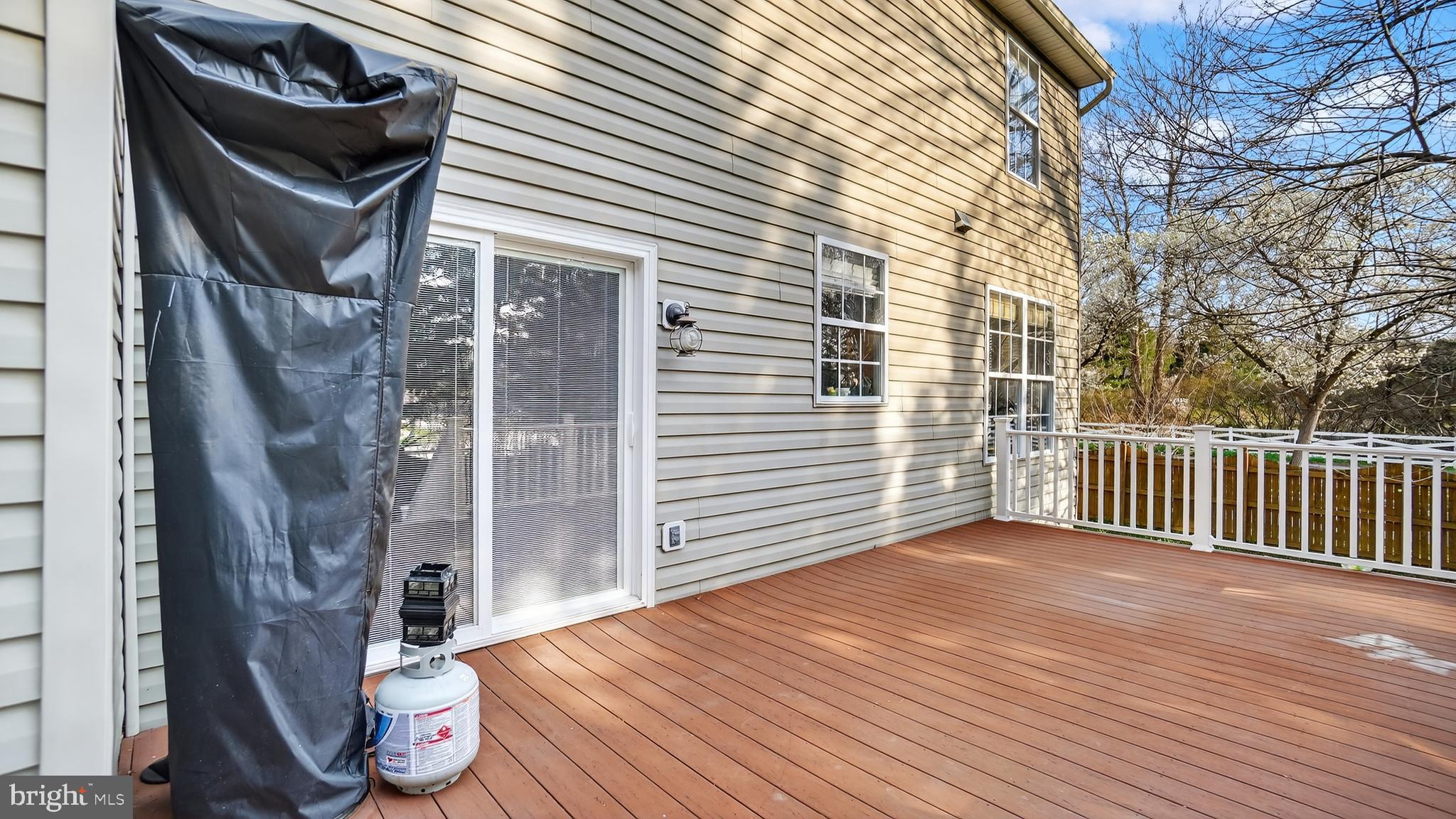 2801 Klein Court Crofton, MD 21114 - Photo 40 of 46 a view of a porch with wooden floor and fence and a floor to ceiling window