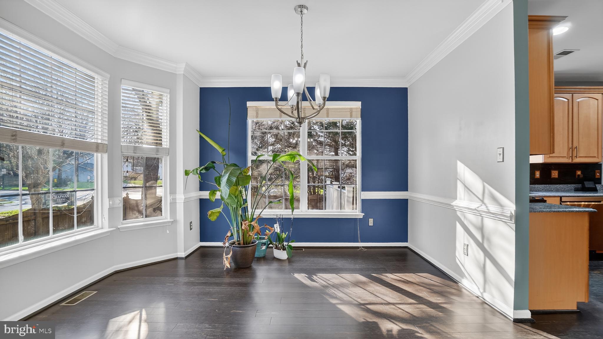 2801 Klein Court Crofton, MD 21114 - Photo 6 of 46 a view of a room with wooden floor windows and a chandelier
