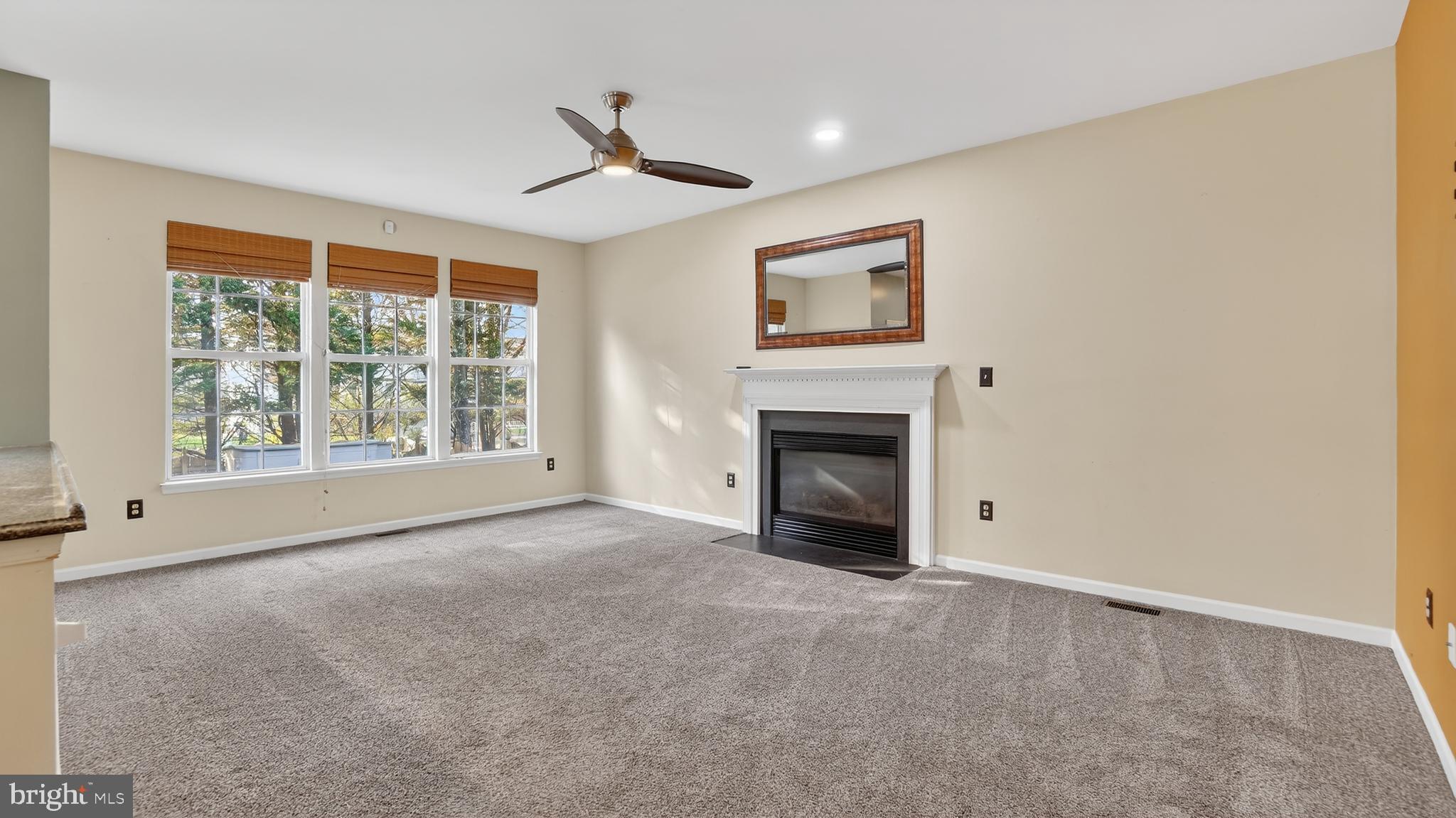 2801 Klein Court Crofton, MD 21114 - Photo 8 of 46 a view of empty room with a fireplace and windows