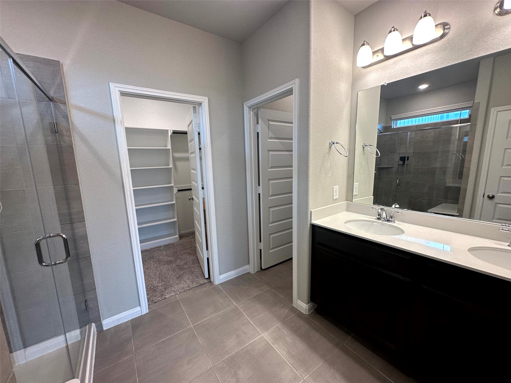 7072 Silverleaf Oak Street Conroe, TX 77304 - Photo 9 of 18 Double vanity and walk-in shower.