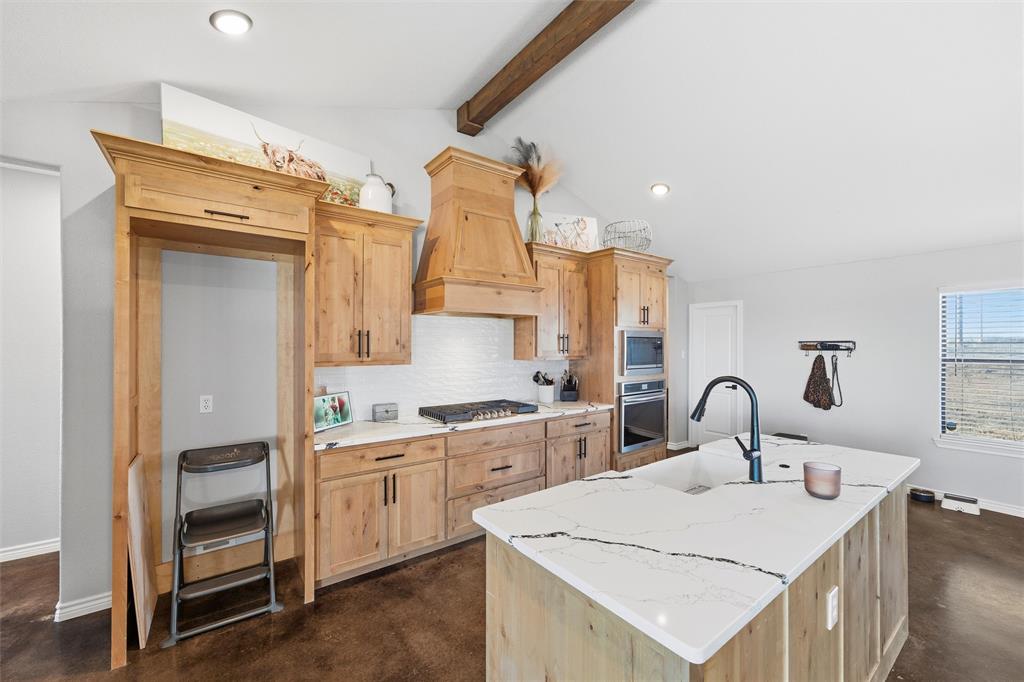 861 Richland Bnd Road Milford, TX 76670 - Photo 11 of 38 a kitchen with a sink a stove and cabinets