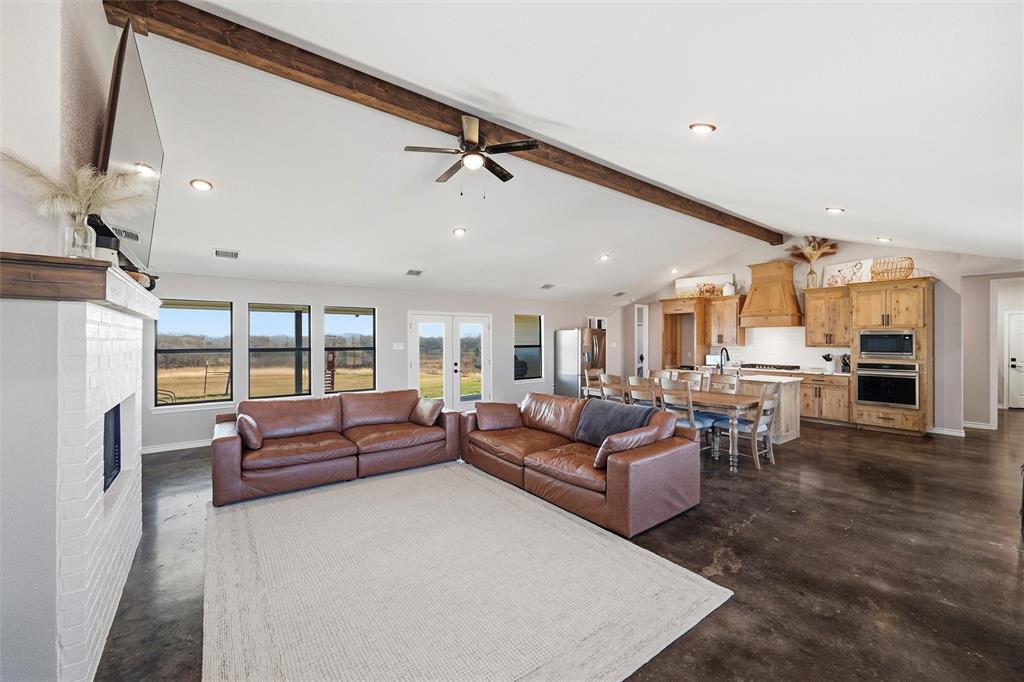 861 Richland Bnd Road Milford, TX 76670 - Photo 13 of 38 a living room with furniture and a large window
