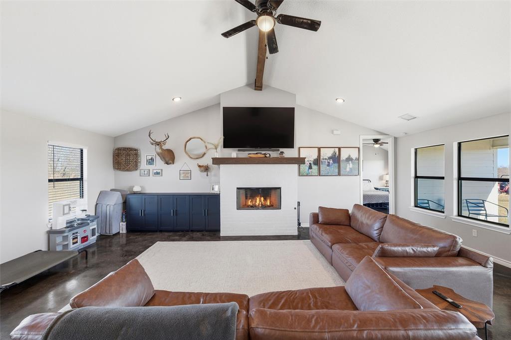 861 Richland Bnd Road Milford, TX 76670 - Photo 15 of 38 a living room with furniture and a flat screen tv