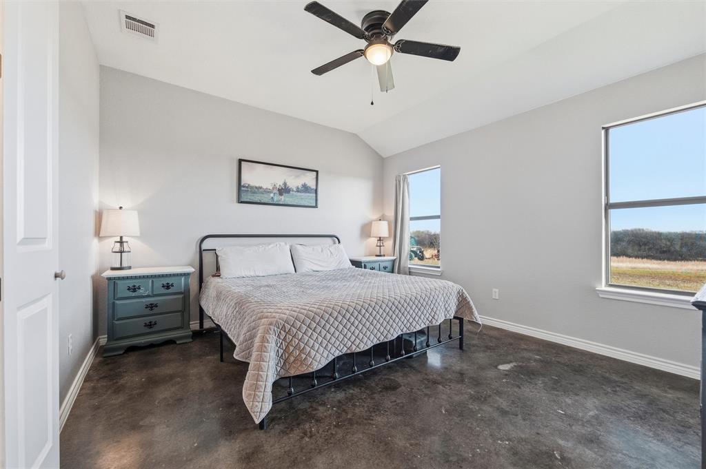 861 Richland Bnd Road Milford, TX 76670 - Photo 18 of 38 a spacious bedroom with a bed and a window