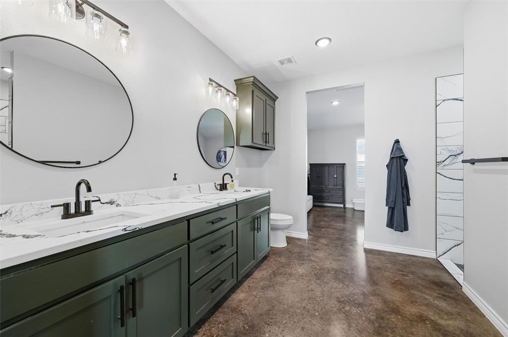 861 Richland Bnd Road Milford, TX 76670 - Photo 20 of 38 a spacious bathroom with a double vanity sink and a mirror