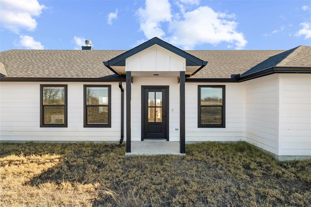 861 Richland Bnd Road Milford, TX 76670 - Photo 2 of 38 a front view of a house with a yard