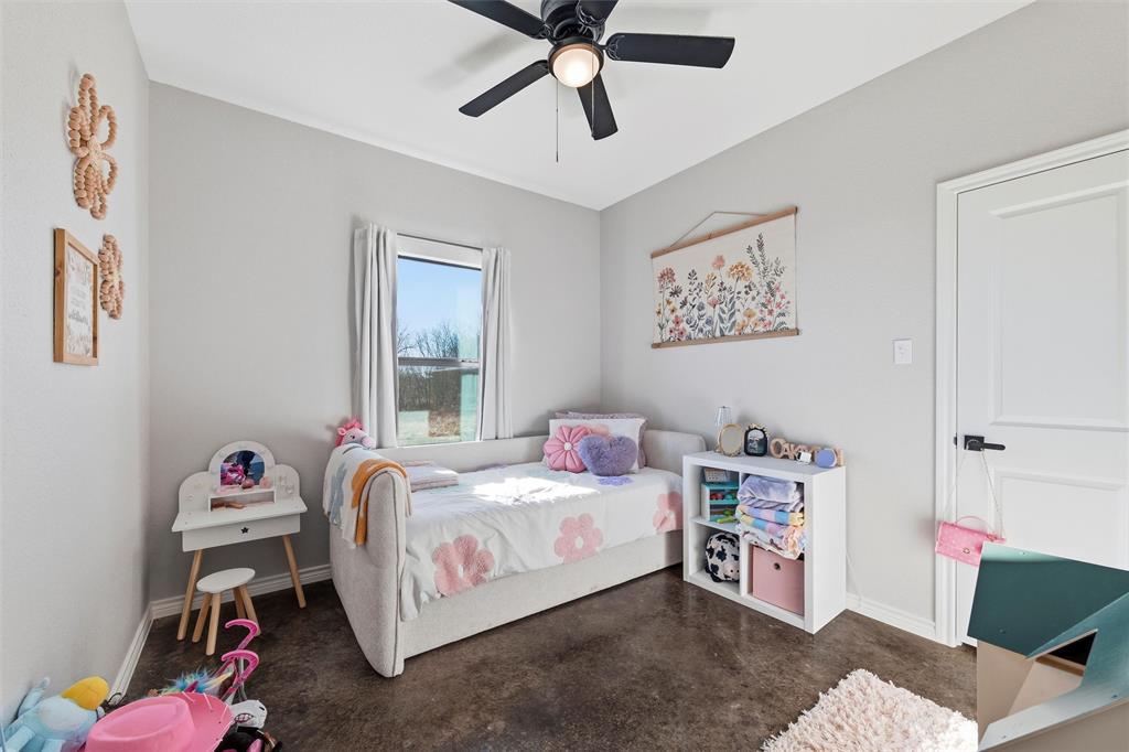 861 Richland Bnd Road Milford, TX 76670 - Photo 25 of 38 a bedroom with a bed and a window