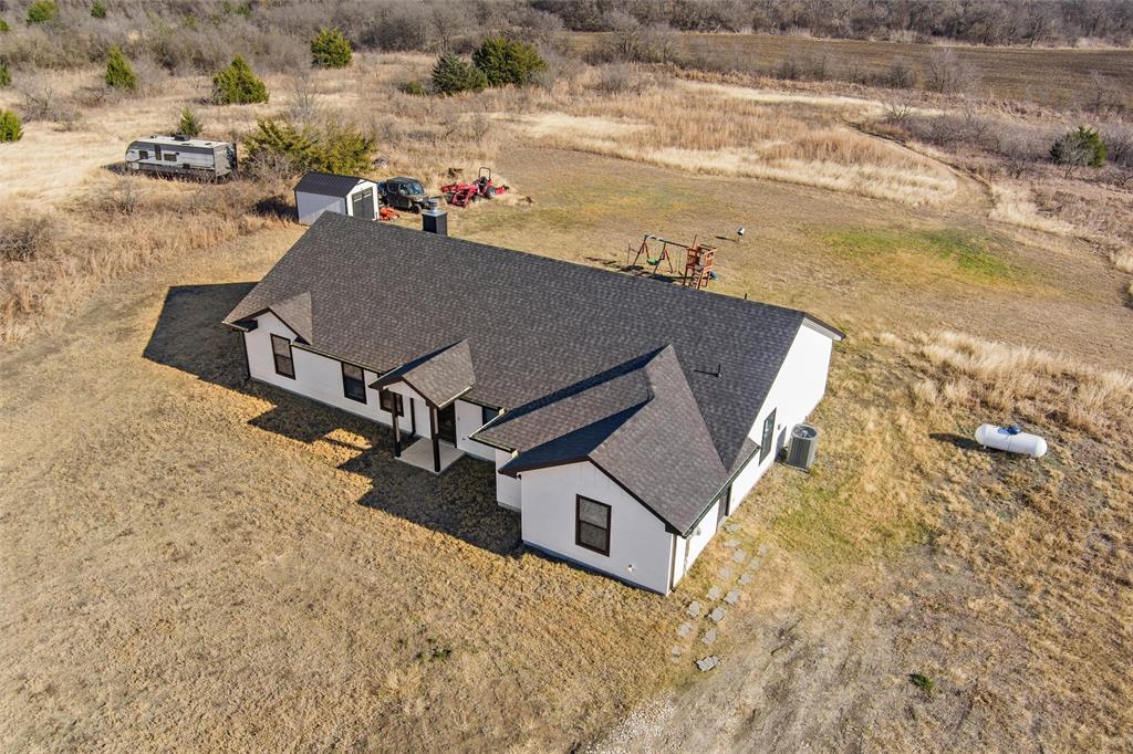 861 Richland Bnd Road Milford, TX 76670 - Photo 3 of 38 an aerial view of houses with outdoor space