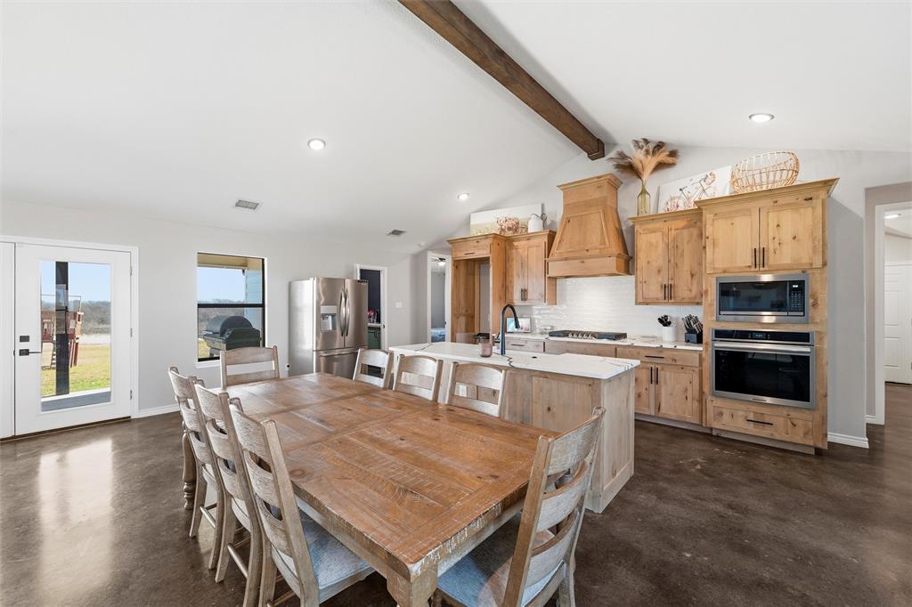 861 Richland Bnd Road Milford, TX 76670 - Photo 5 of 38 a large kitchen with a table and chairs in it