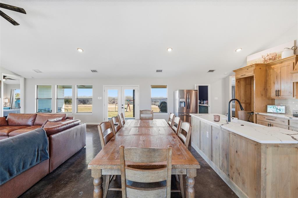 861 Richland Bnd Road Milford, TX 76670 - Photo 6 of 38 a view of a dining room with furniture window and wooden floor