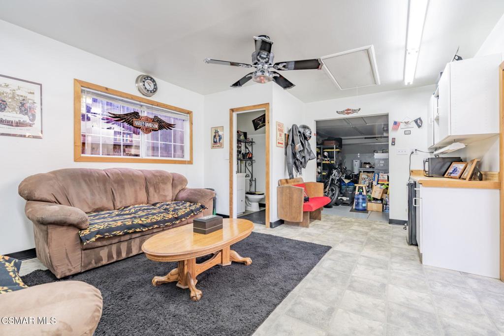 6078 Peppertree Lane Simi Valley, CA 93063 - Photo 46 of 59 a living room with furniture a air conditioner and a table