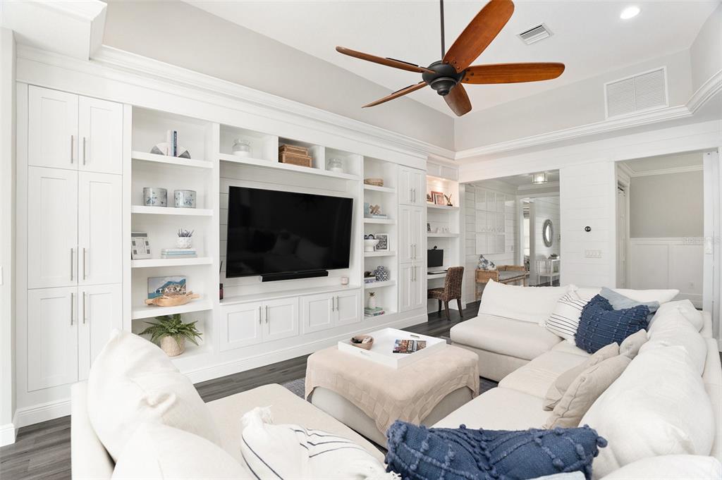6408 Key Island Avenue Apollo Beach, FL 33572 - Photo 14 of 54 a living room with furniture a flat screen tv and a view of kitchen