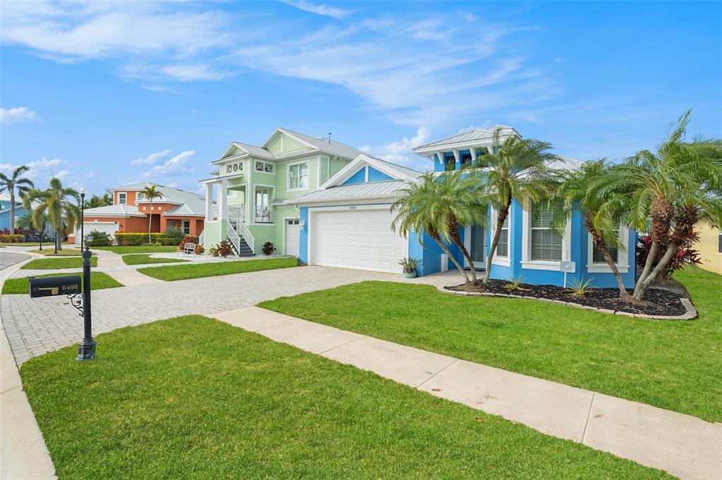 6408 Key Island Avenue Apollo Beach, FL 33572 - Photo 2 of 54 a view of a palm trees in front of a house