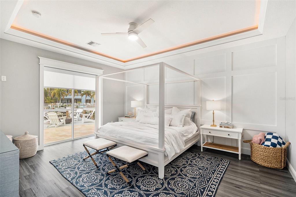 6408 Key Island Avenue Apollo Beach, FL 33572 - Photo 24 of 54 a bedroom with a bed and wooden floor