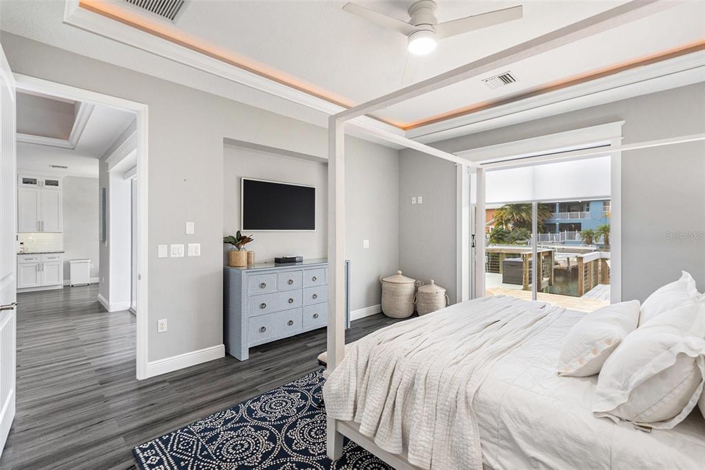 6408 Key Island Avenue Apollo Beach, FL 33572 - Photo 26 of 54 a bedroom with a bed and a flat screen tv