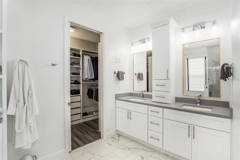 6408 Key Island Avenue Apollo Beach, FL 33572 - Photo 29 of 54 a spacious bathroom with a shower double vanity and a sink
