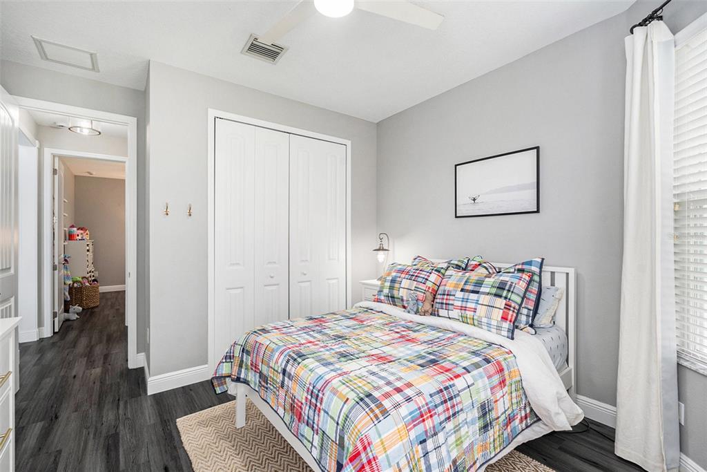 6408 Key Island Avenue Apollo Beach, FL 33572 - Photo 33 of 54 a bedroom with a bed and a dresser