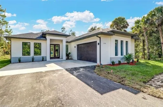 front view of a house with a yard