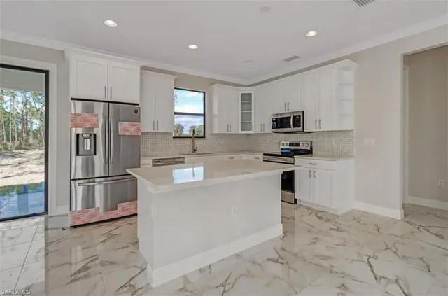 a view of an empty room with a fireplace