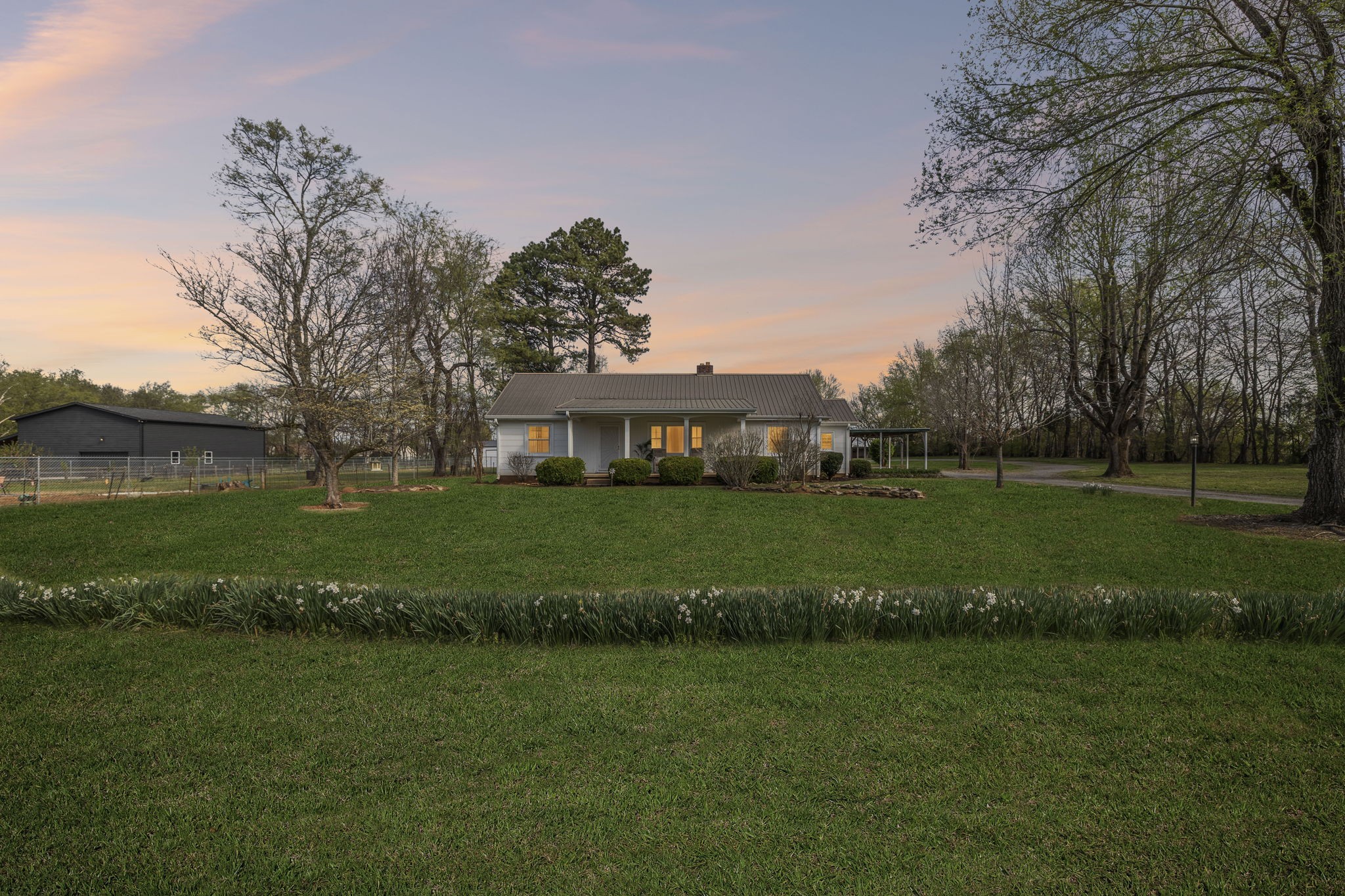 3026 Dilton Mankin Road Murfreesboro, TN 37127 - Photo 1 of 64 a front view of a house with a yard table and chairs