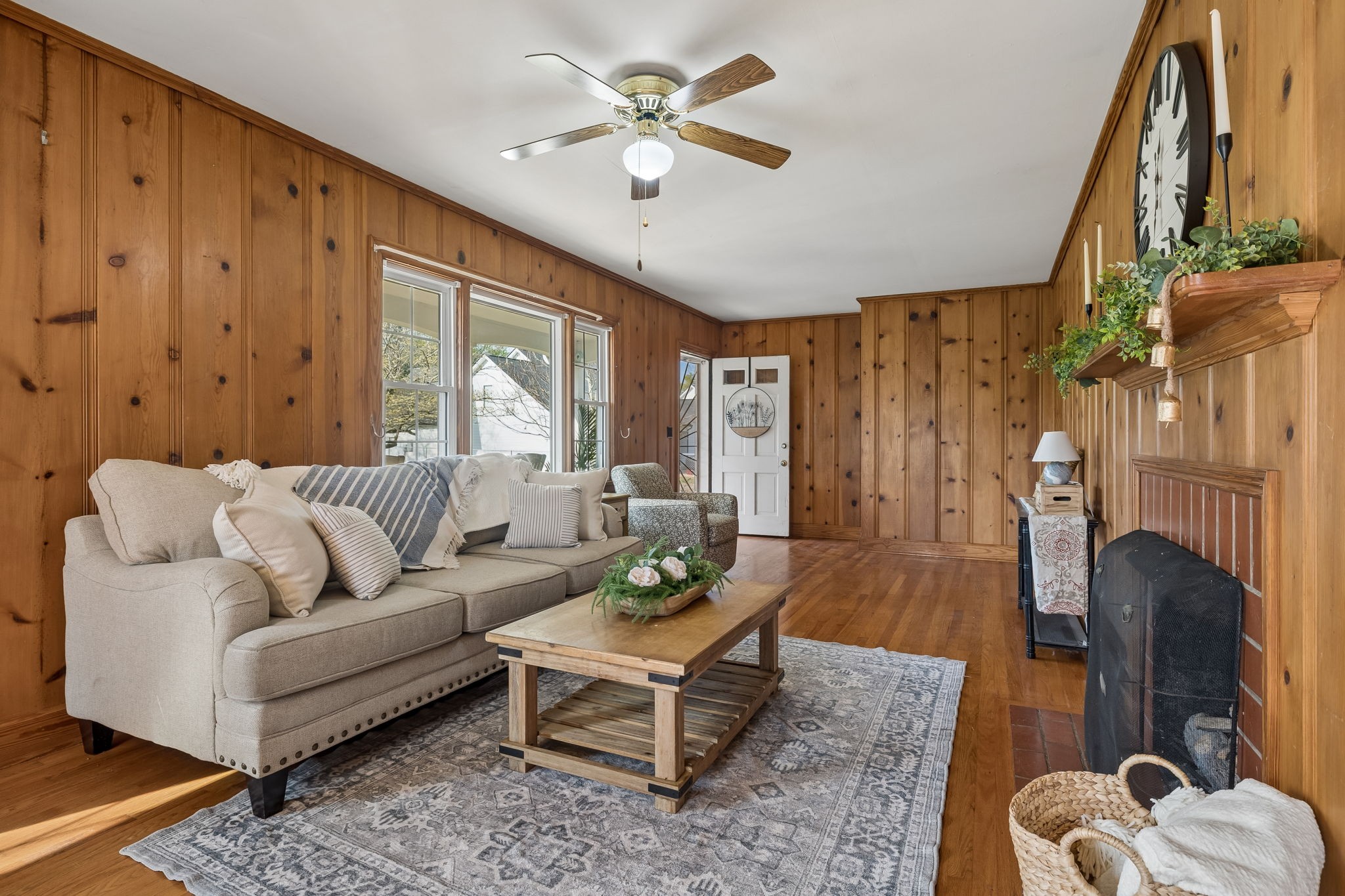 3026 Dilton Mankin Road Murfreesboro, TN 37127 - Photo 14 of 64 a living room with furniture a fireplace and a chandelier