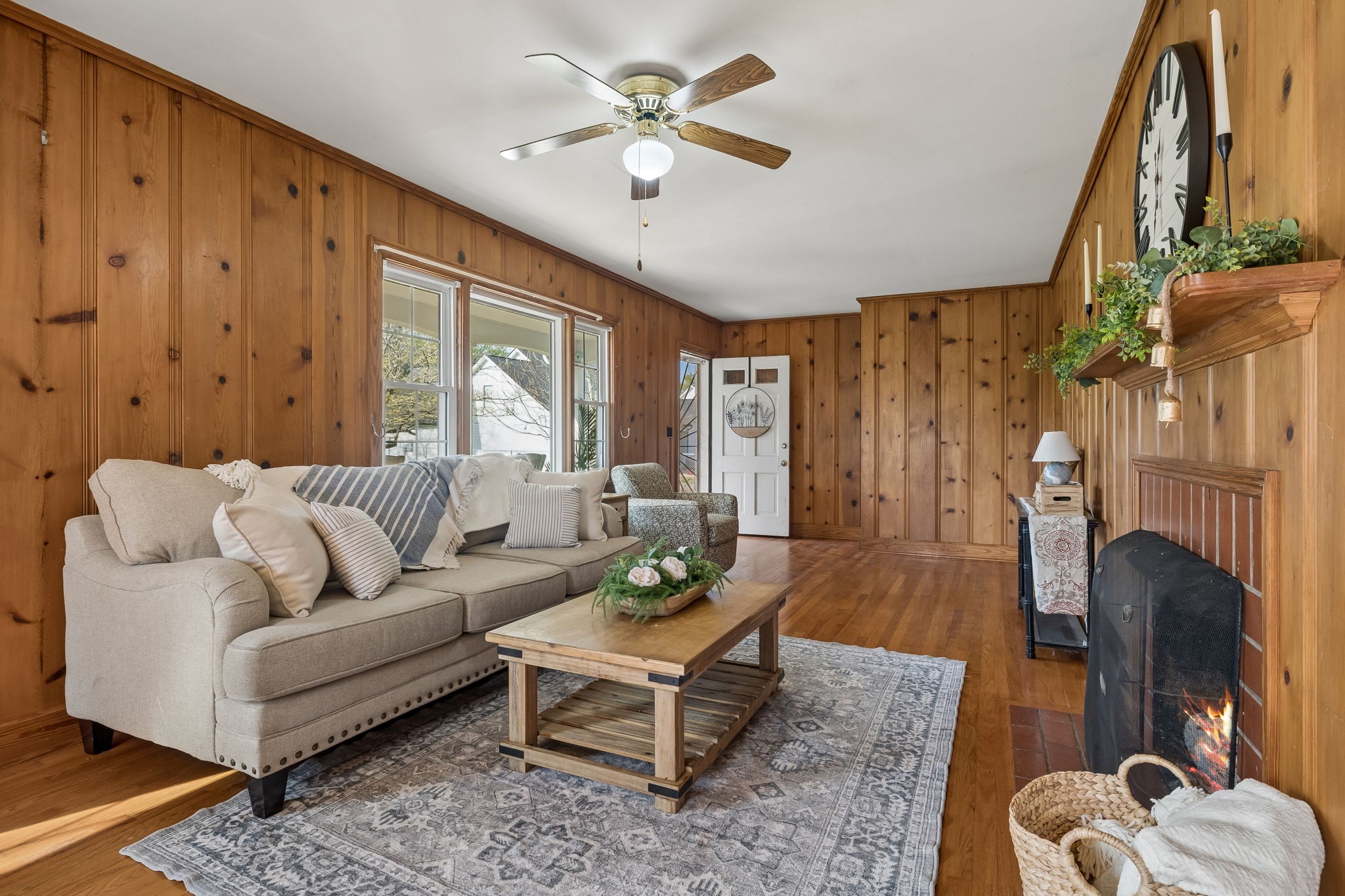 3026 Dilton Mankin Road Murfreesboro, TN 37127 - Photo 17 of 64 a living room with furniture a fireplace and a chandelier