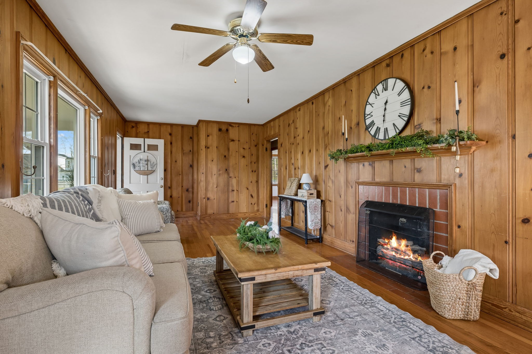 3026 Dilton Mankin Road Murfreesboro, TN 37127 - Photo 33 of 64 a living room with furniture a clock and a fireplace