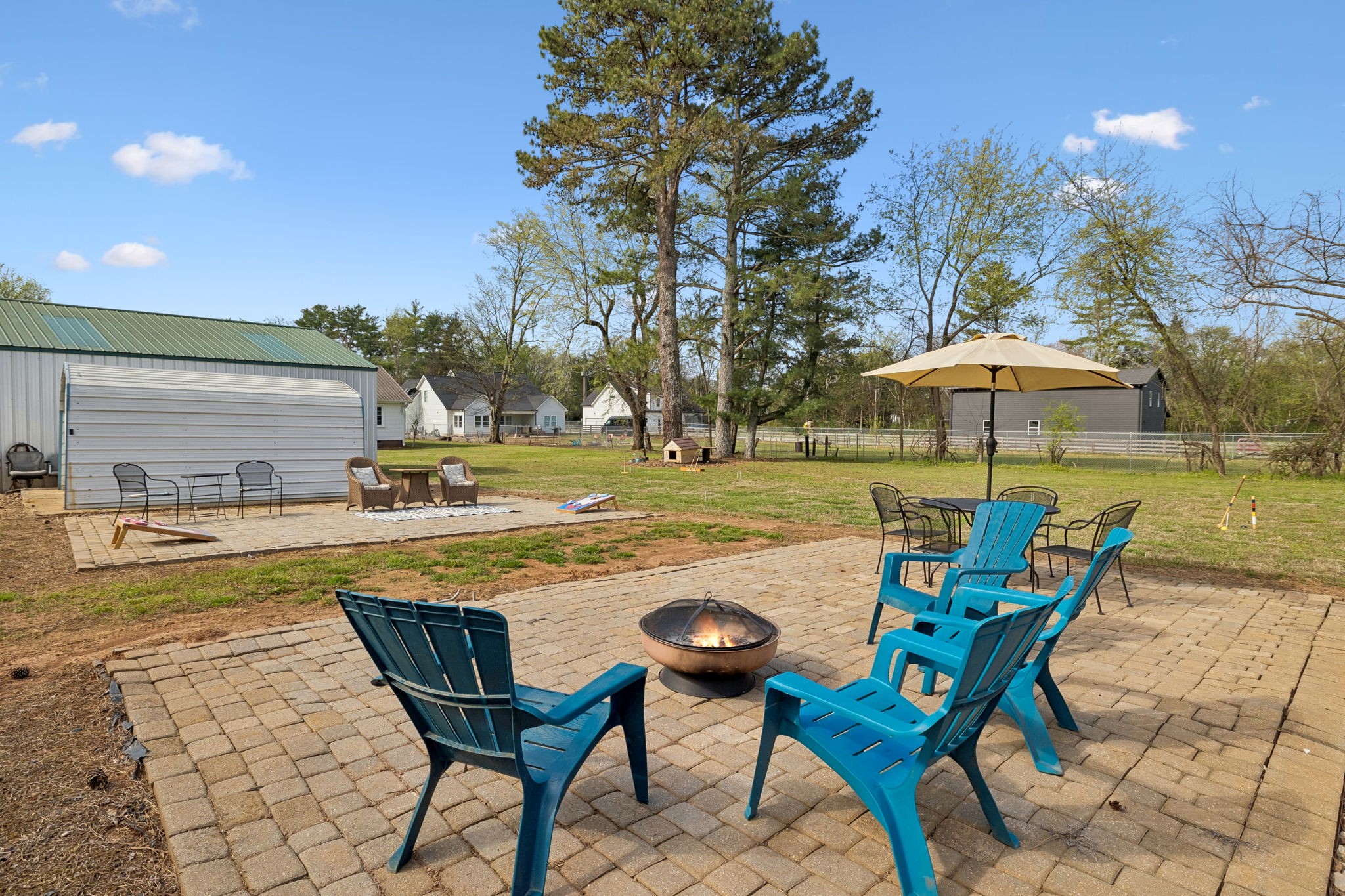 3026 Dilton Mankin Road Murfreesboro, TN 37127 - Photo 46 of 64 a view of a swimming pool with a table and chairs under an umbrella