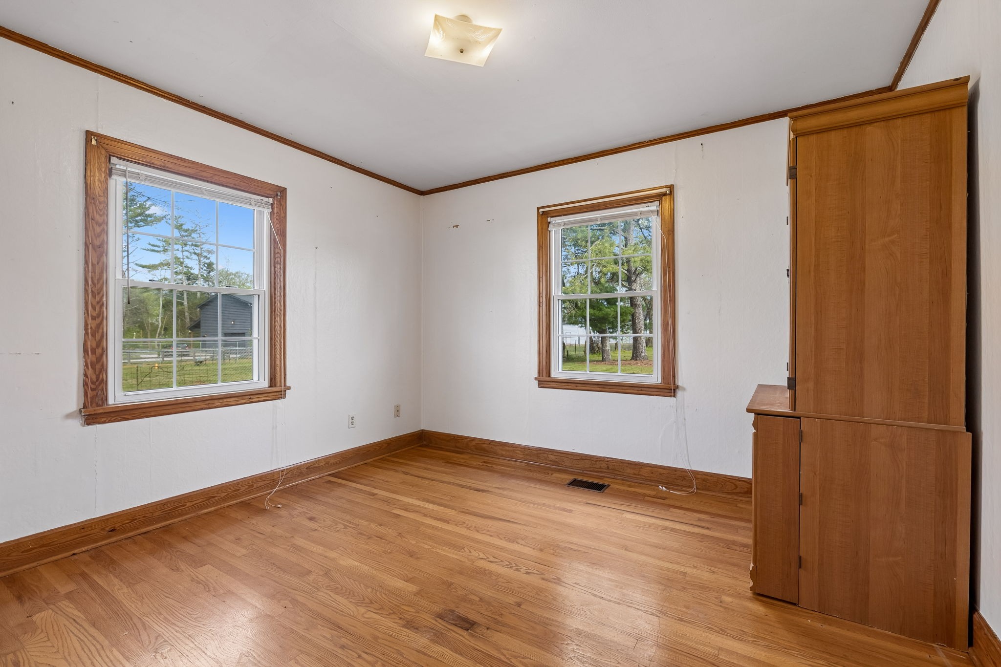 3026 Dilton Mankin Road Murfreesboro, TN 37127 - Photo 47 of 64 a view of empty room with wooden floor and fan