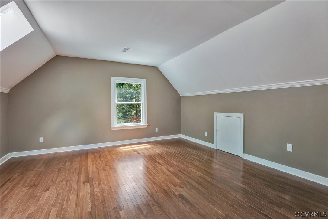 11505 Winterpock Road Chesterfield, VA 23838 - Photo 14 of 30 a view of an empty room with wooden floor and a window