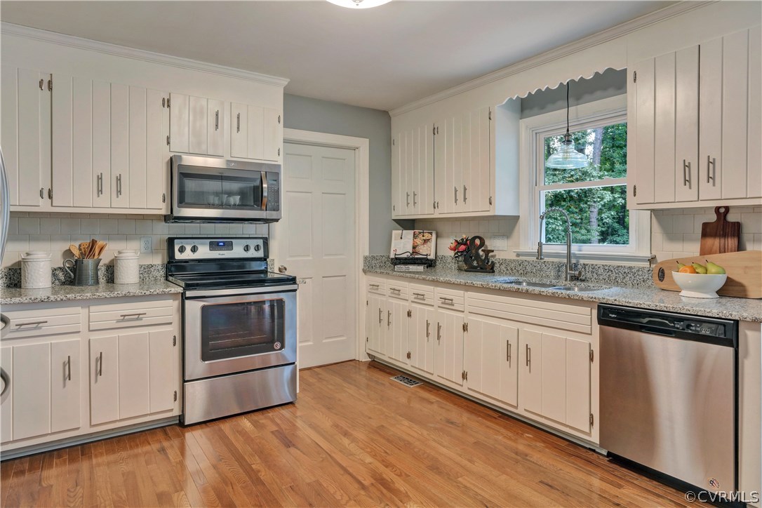 11505 Winterpock Road Chesterfield, VA 23838 - Photo 4 of 30 a kitchen with granite countertop white cabinets and white appliances